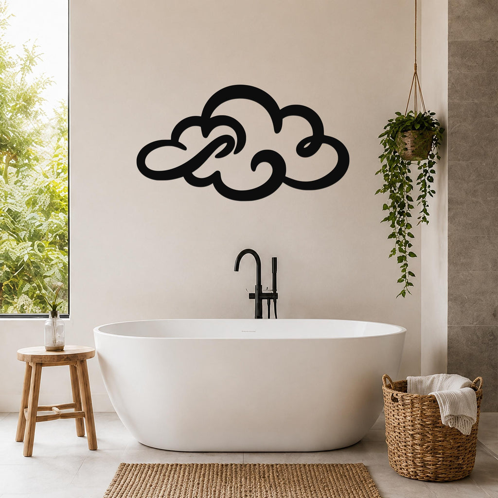 Black metal cloud wall art with flowing silhouette cutouts, mounted above a freestanding bathtub in a bright bathroom.