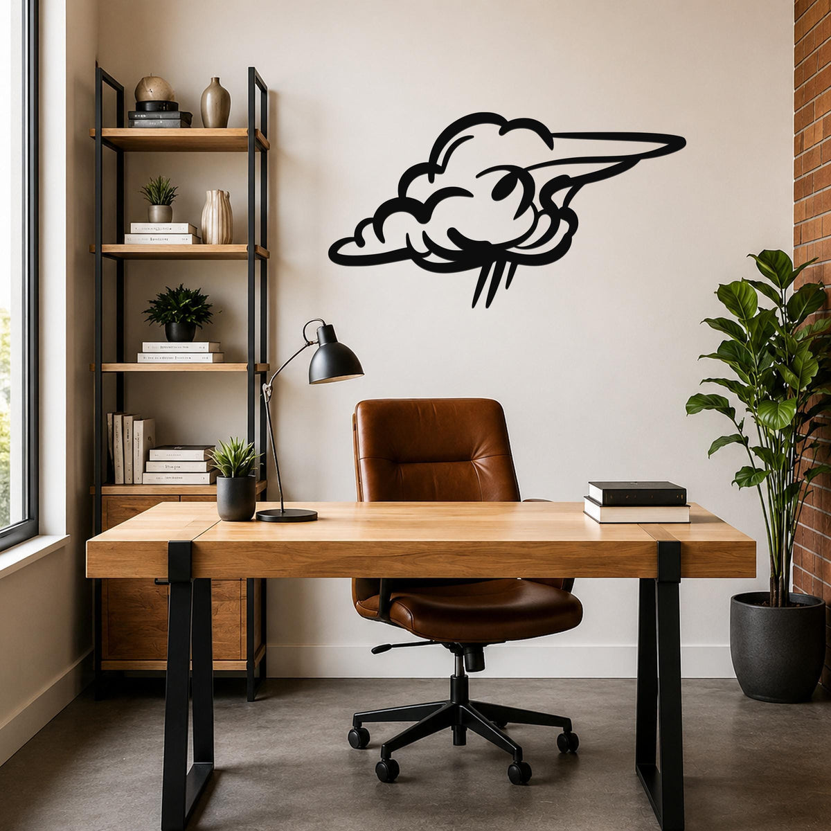 Black metal cloud wall art with a stylized, flowing silhouette, mounted on a wall above a wooden desk in a modern home office.