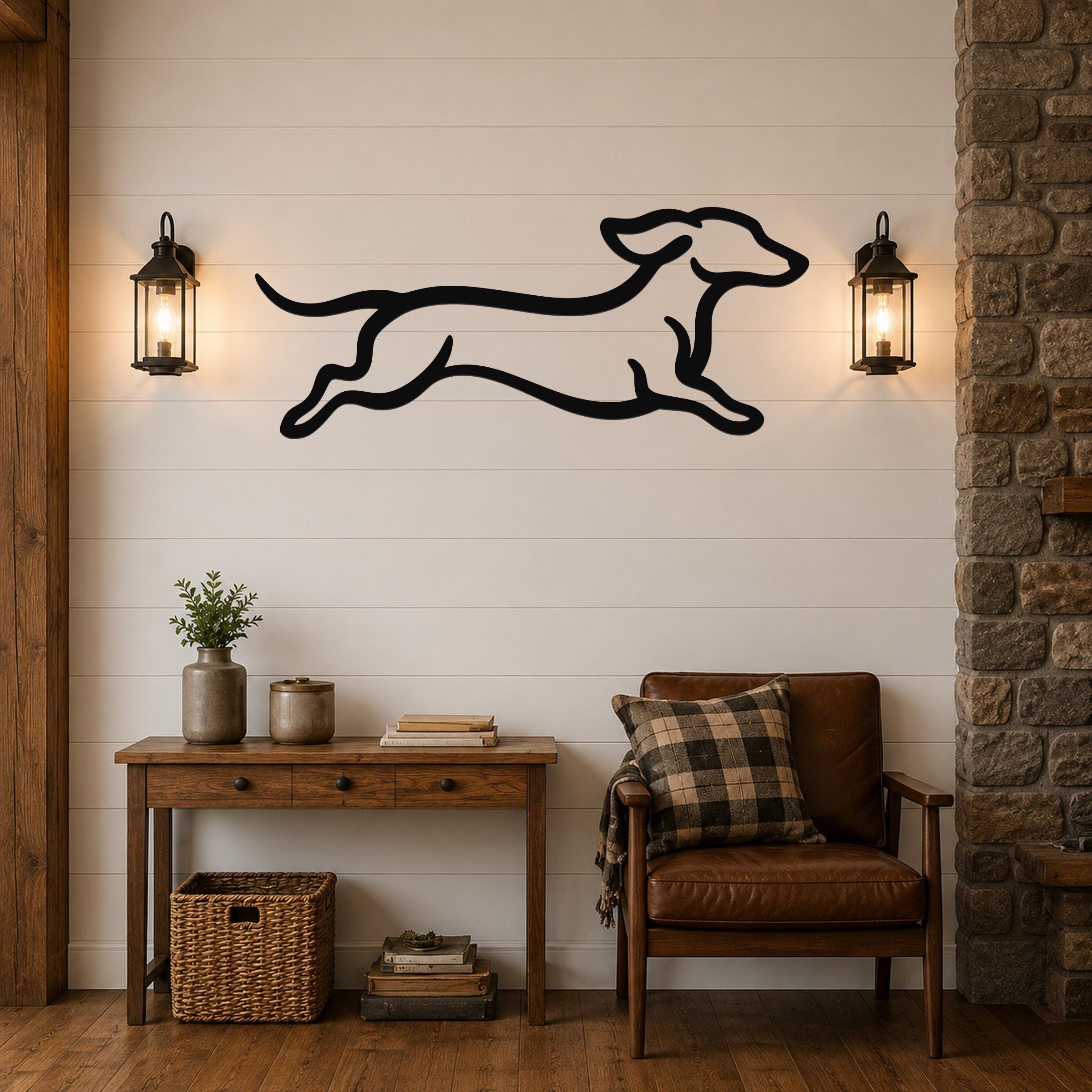 Black metal dachshund wall art with motion-line cutouts, mounted on a shiplap wall above a wooden console table in a living room.