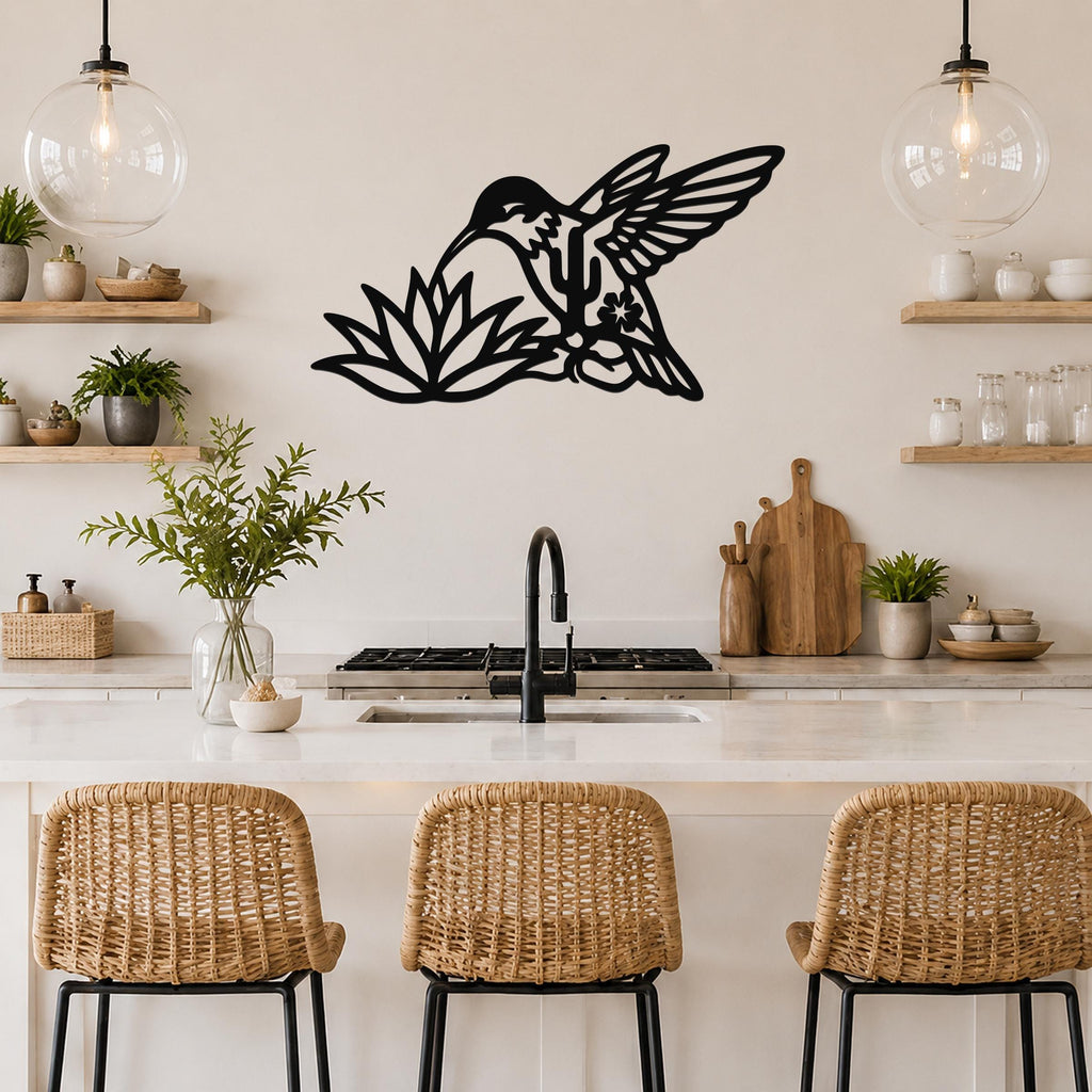 Black metal hummingbird wall art with cactus and flower cutouts, mounted above a kitchen counter.