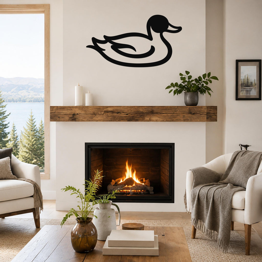 Black metal duck wall art silhouette mounted above a fireplace in a living room with a lake view.