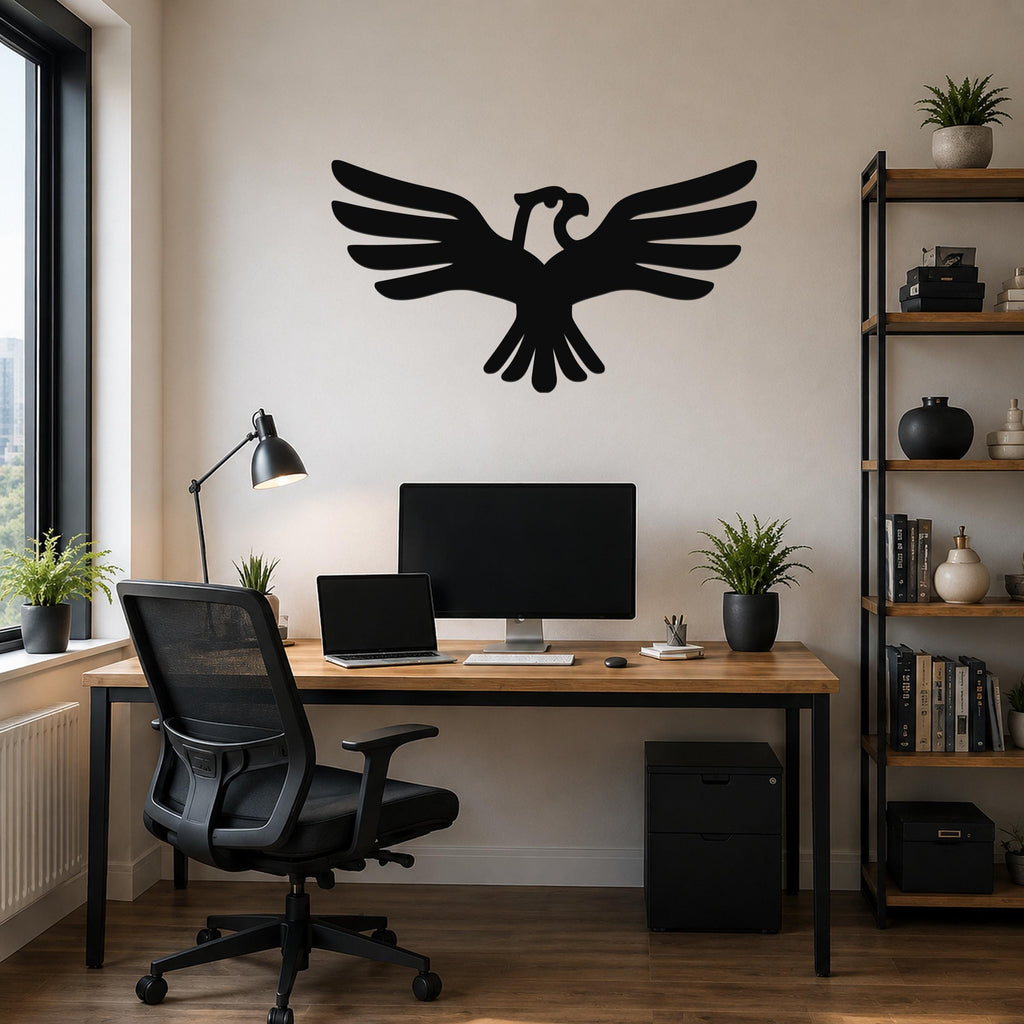 Black metal eagle wall art with outstretched wings and a cutout design, mounted above a wooden desk in a home office.