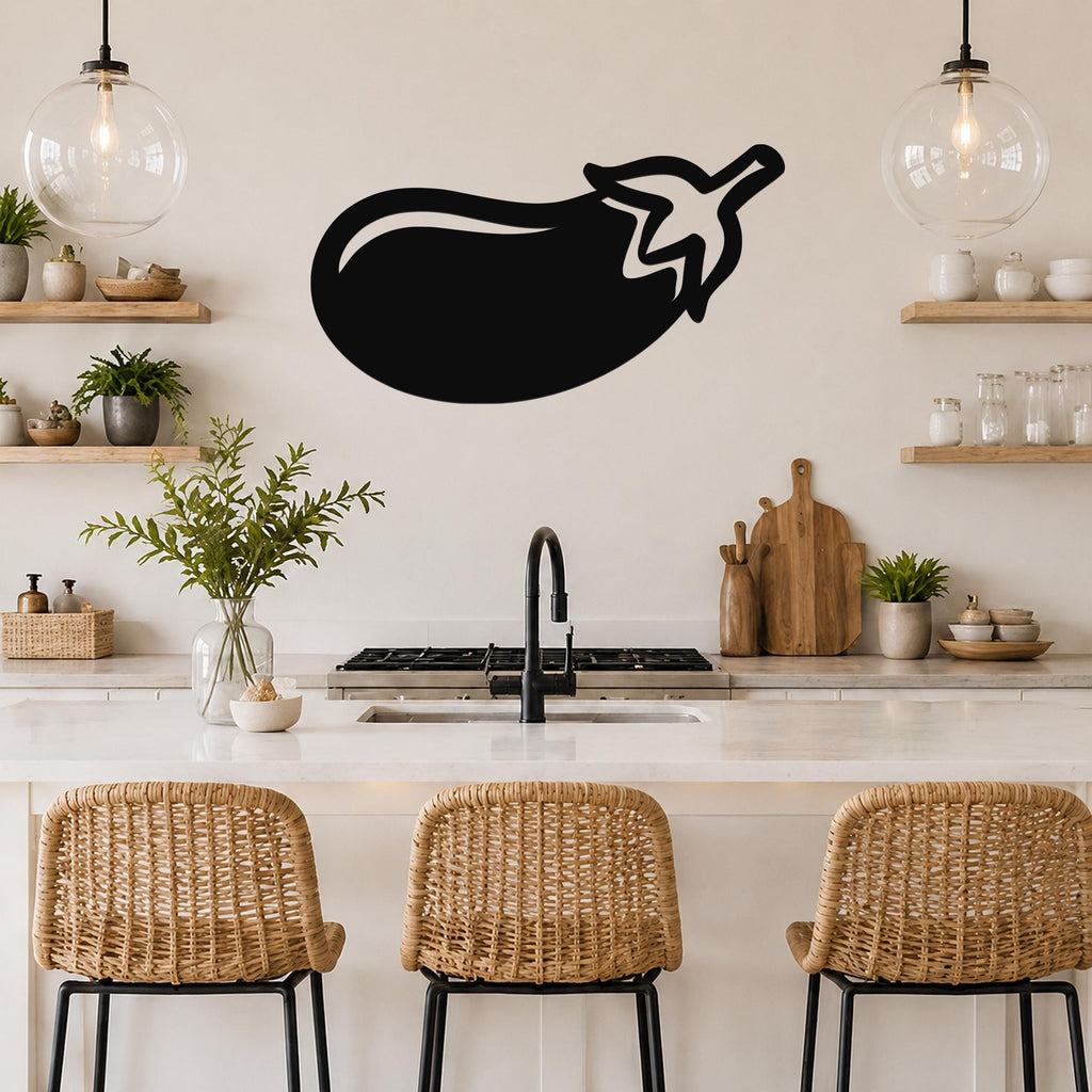Black metal eggplant wall art silhouette mounted above a kitchen counter, with a simple outline and stem detail.
