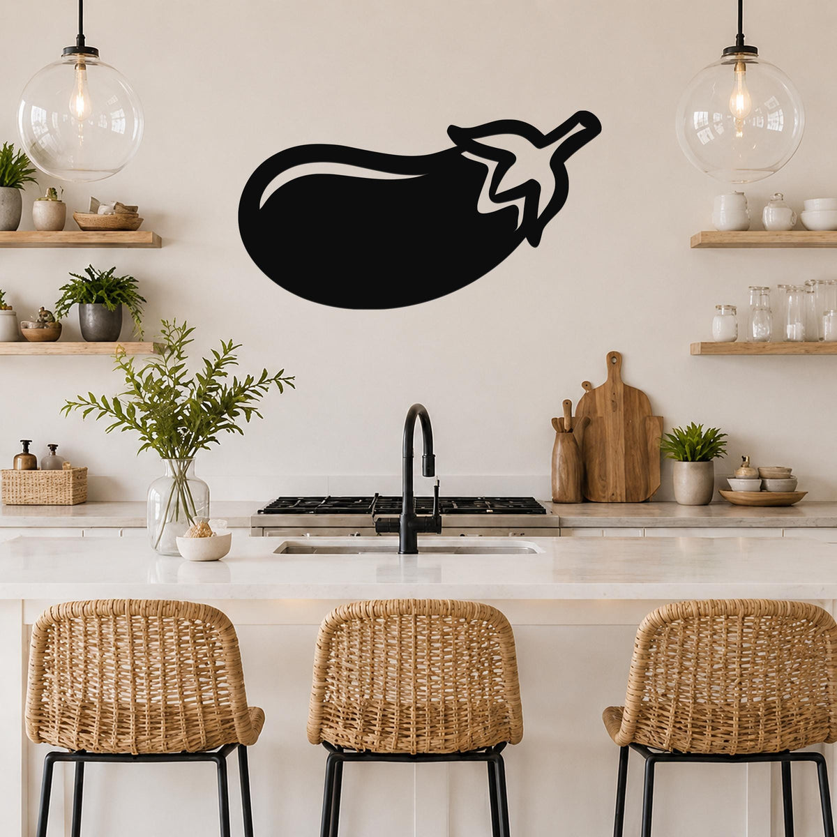 Black metal eggplant wall art silhouette mounted above a kitchen counter, with a simple outline and stem detail.