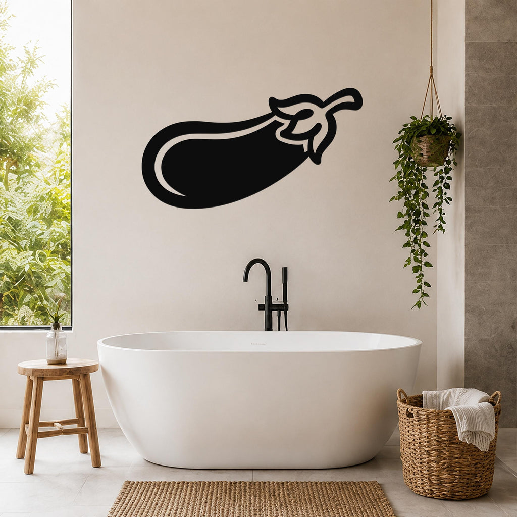 Black metal eggplant wall art silhouette mounted on a bathroom wall above a freestanding tub.