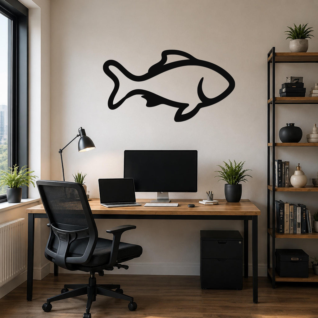Black metal fish wall art with bold outline cutout, mounted above a wooden desk in a modern home office.
