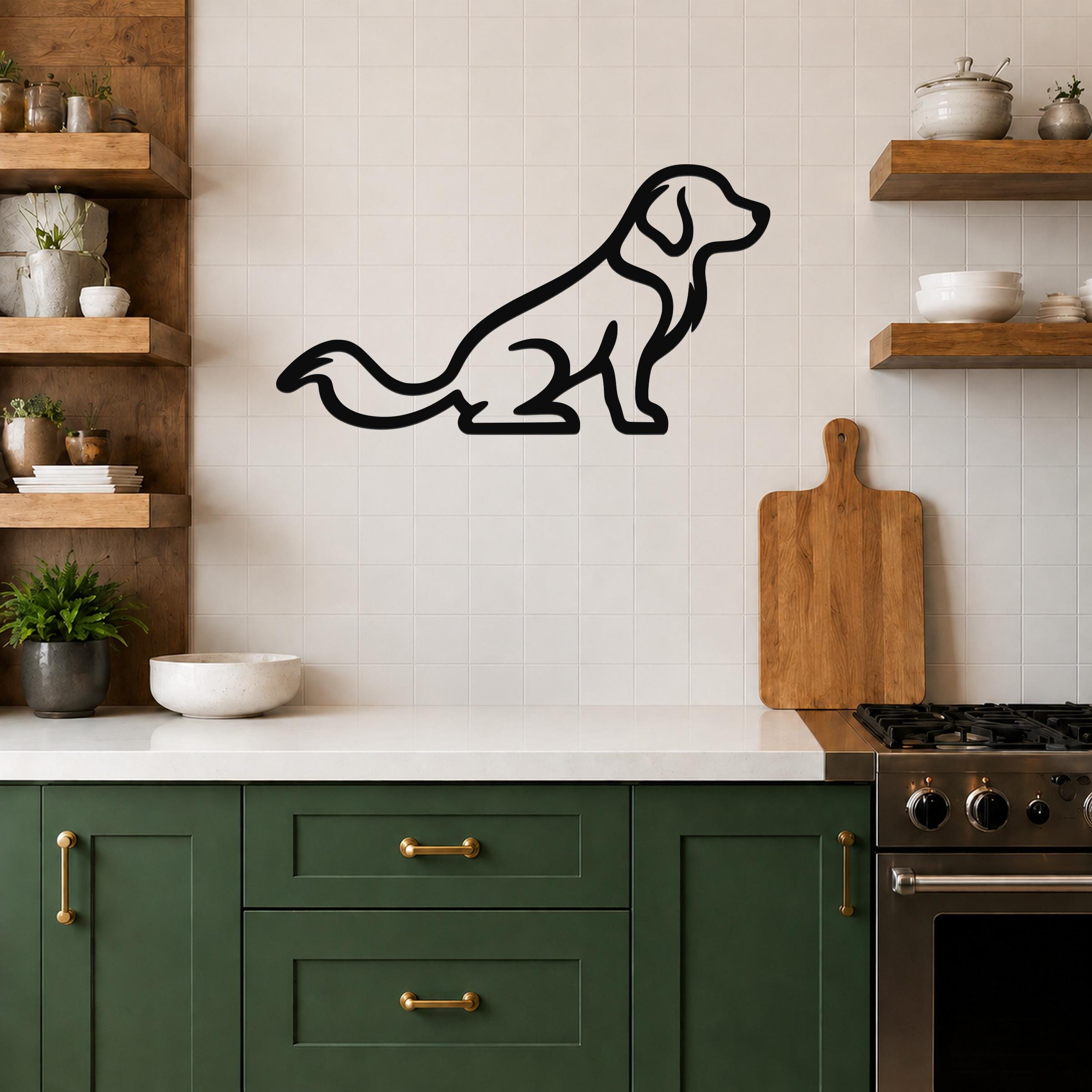 Black metal dog silhouette wall art of a sitting golden retriever, mounted on a white tiled kitchen wall above a counter.