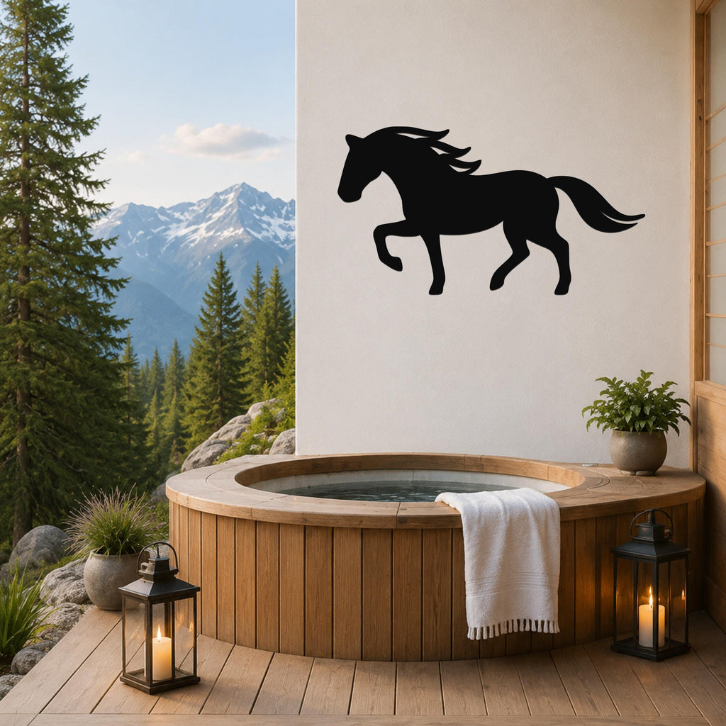 Black metal horse silhouette wall art mounted on a white wall above a wooden hot tub on a mountain-view deck.