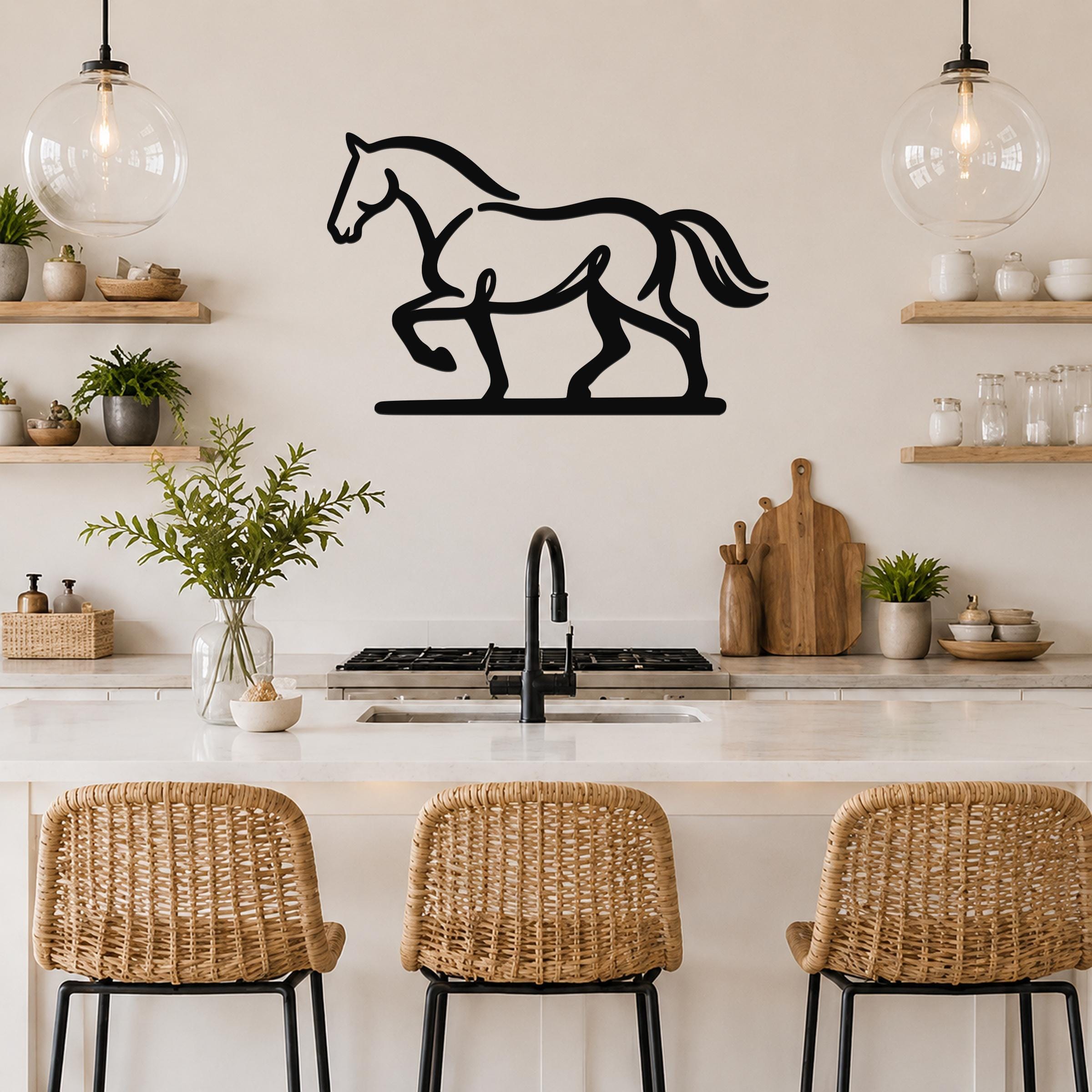 Black metal horse silhouette wall art with motion-line cutouts, mounted above a kitchen counter in a modern rustic kitchen.