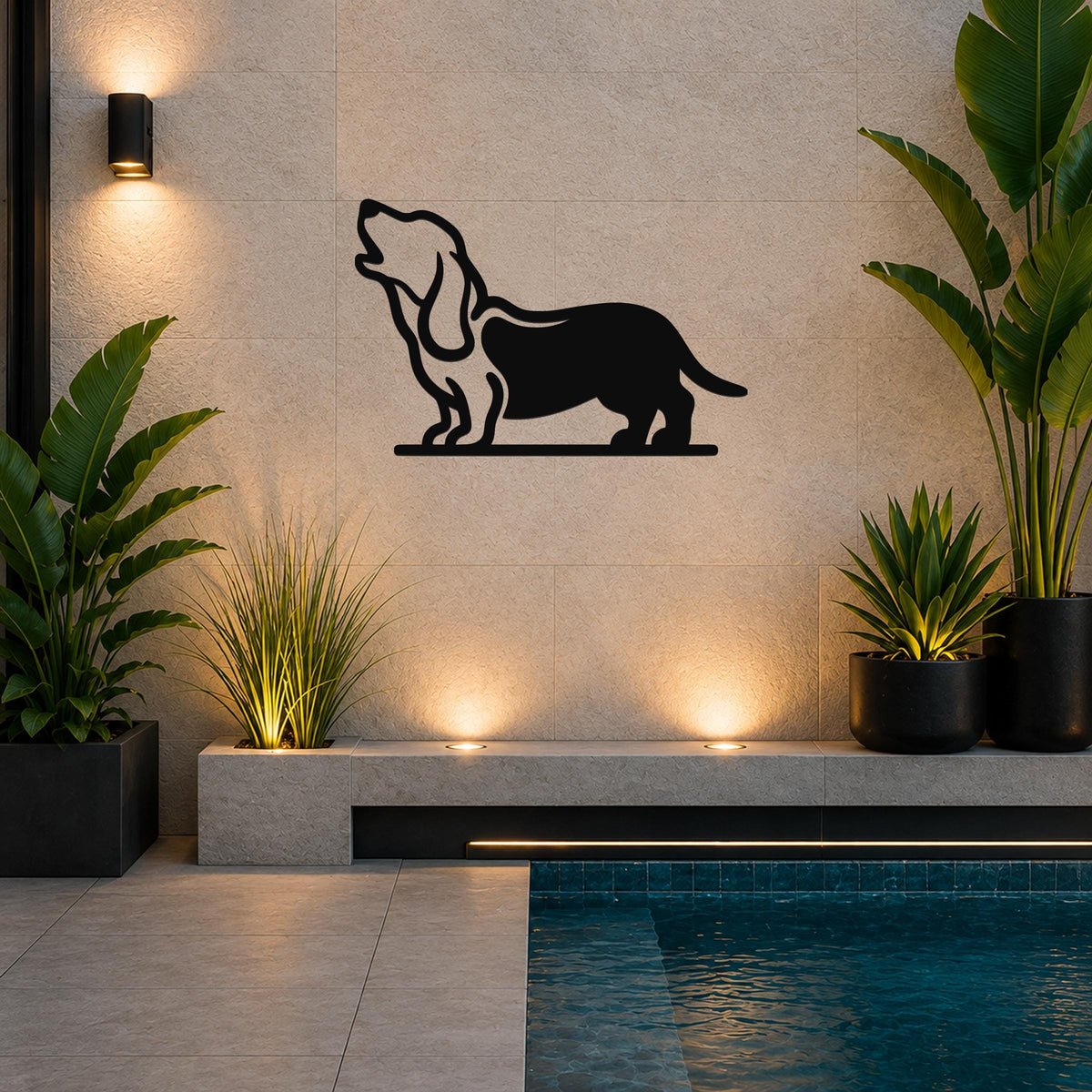 Black metal wall art of a howling basset hound silhouette, mounted on a tiled outdoor wall above a poolside planter.