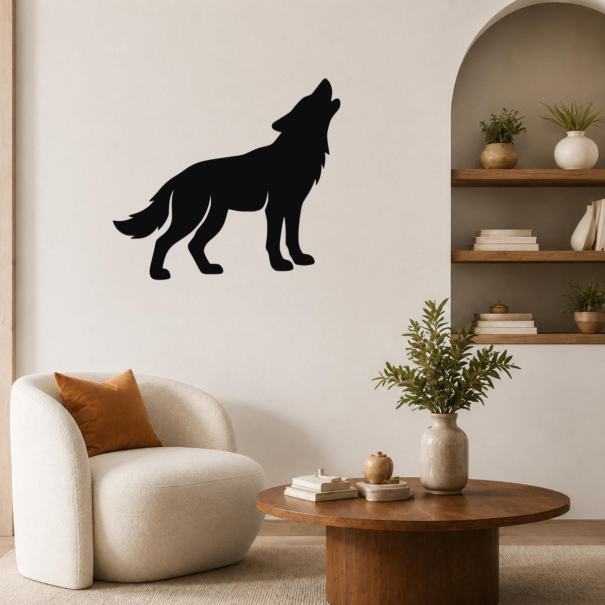 Black metal coyote wall art in a howling silhouette, mounted on a living room wall above a round wooden coffee table.