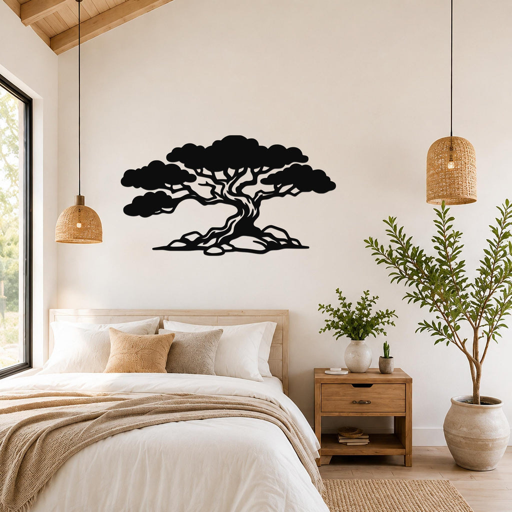 Black metal wall art of a wind-sculpted juniper tree silhouette, mounted above a bed in a bedroom with wooden furniture and woven pendant lights.