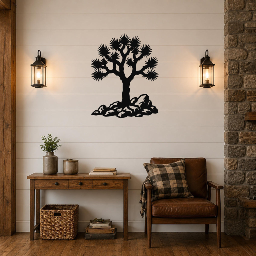 Black metal wall art silhouette of a Joshua tree with rocky base, mounted on a shiplap wall above a wooden console table in a living room.