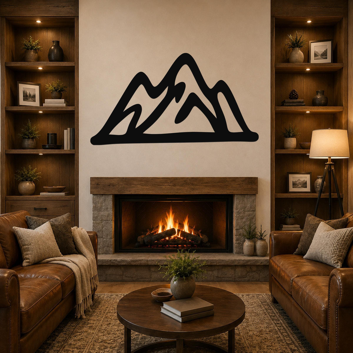Black metal mountain silhouette wall art with layered peaks, mounted above a stone fireplace in a rustic living room.