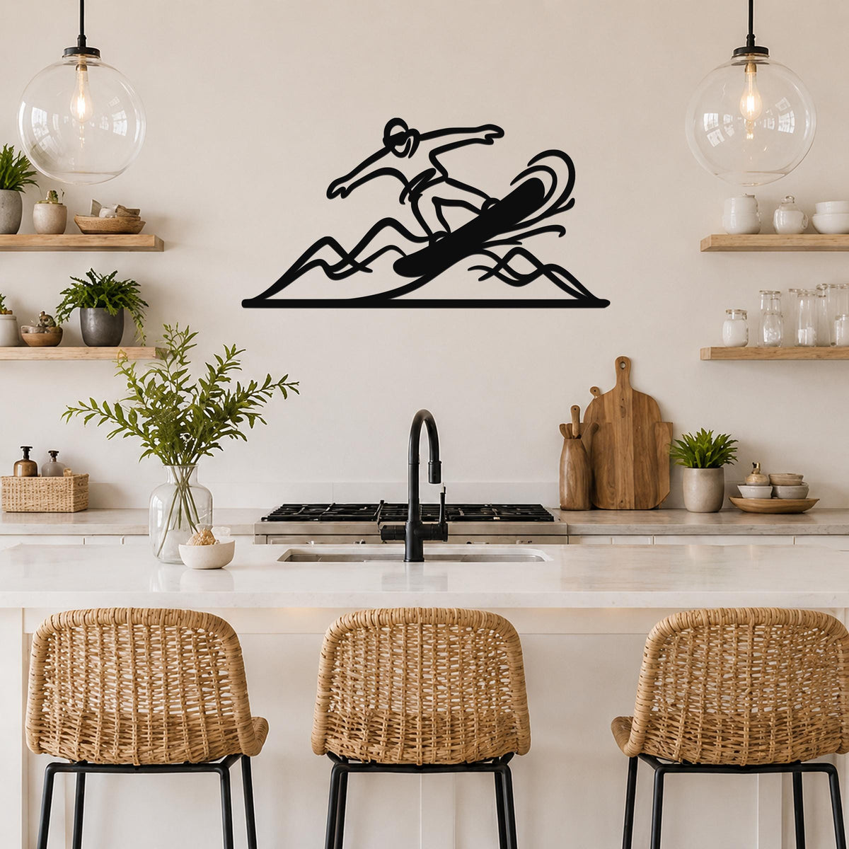 Black metal wall art silhouette of a snowboarder in motion, mounted above a kitchen counter with wicker bar stools.