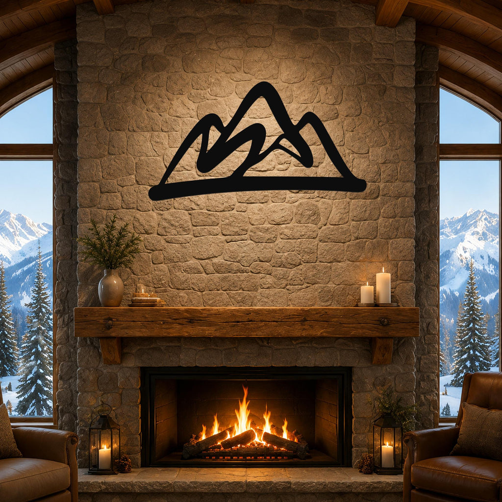 Black metal mountain silhouette wall art mounted above a stone fireplace in a rustic living room with large windows showing snowy peaks.