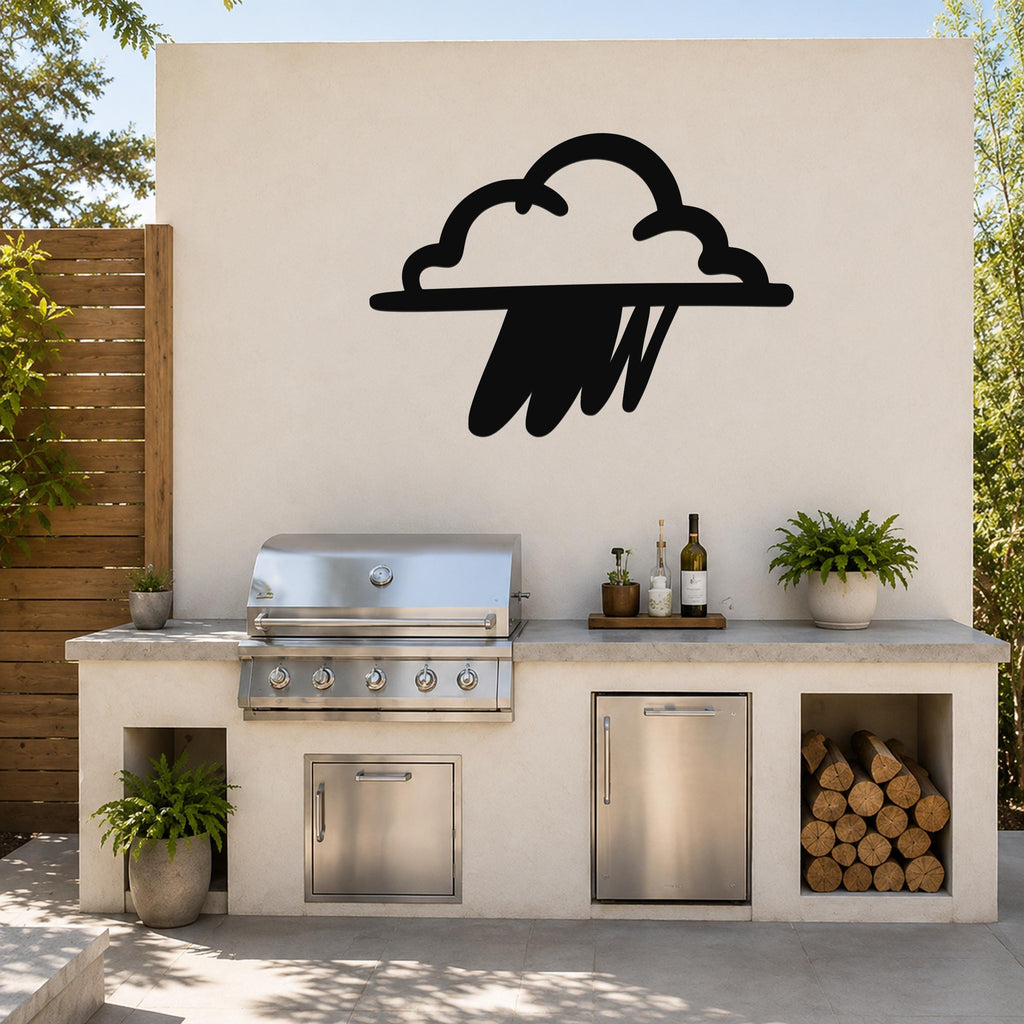 Black metal rain cloud wall art with raindrop cutouts, mounted on an outdoor kitchen wall above a stainless steel grill and counter.