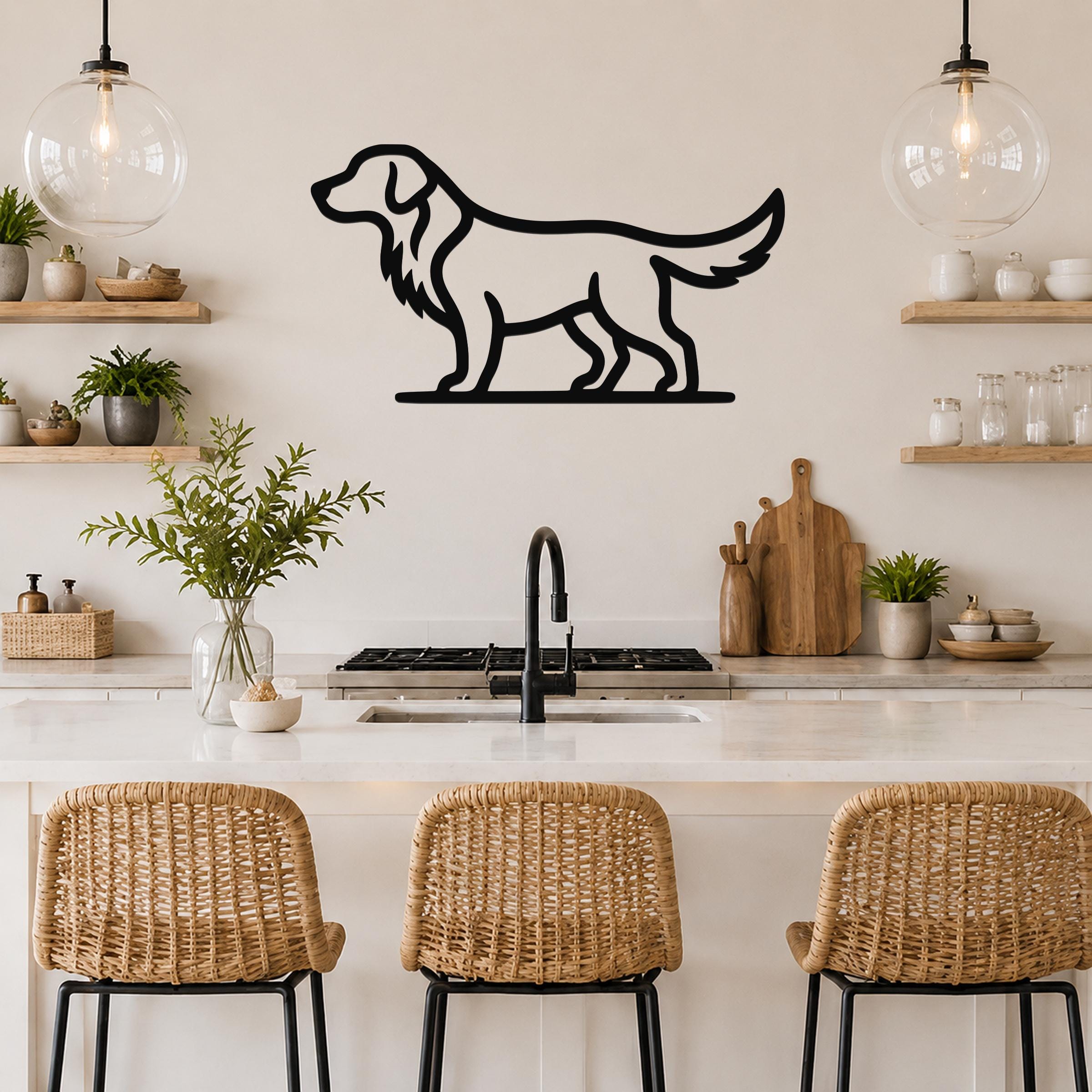 Black metal retriever silhouette wall art mounted on a kitchen wall above a counter, with wicker bar stools and open shelves visible below.