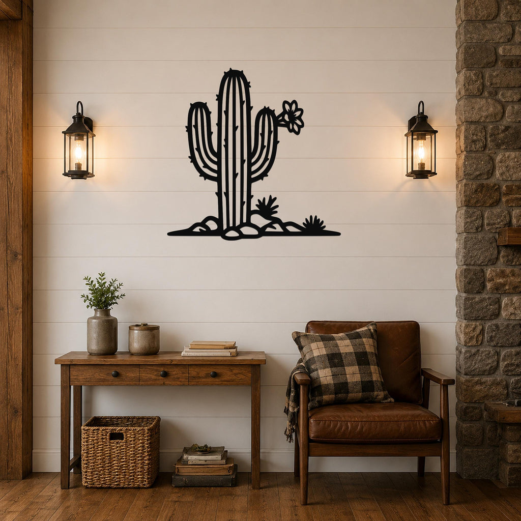 Black metal cactus wall art with flower and spines cutouts, mounted on a white shiplap wall above a wooden console table in a living room.