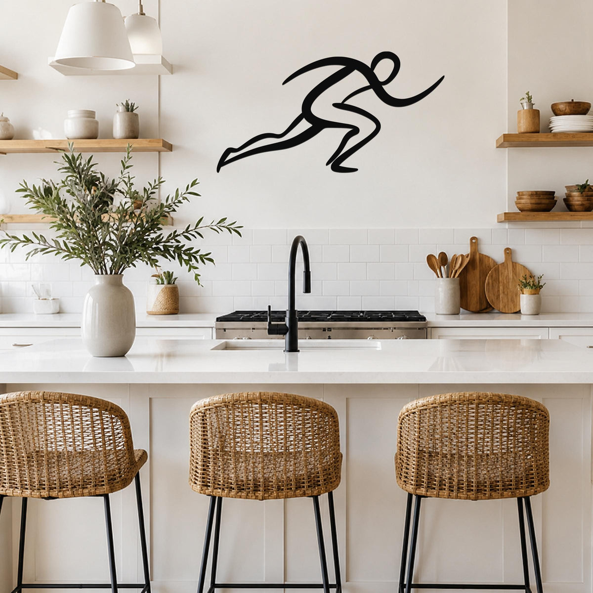 Black metal runner wall art with motion-line cutouts, mounted above a kitchen counter in a bright, modern kitchen.