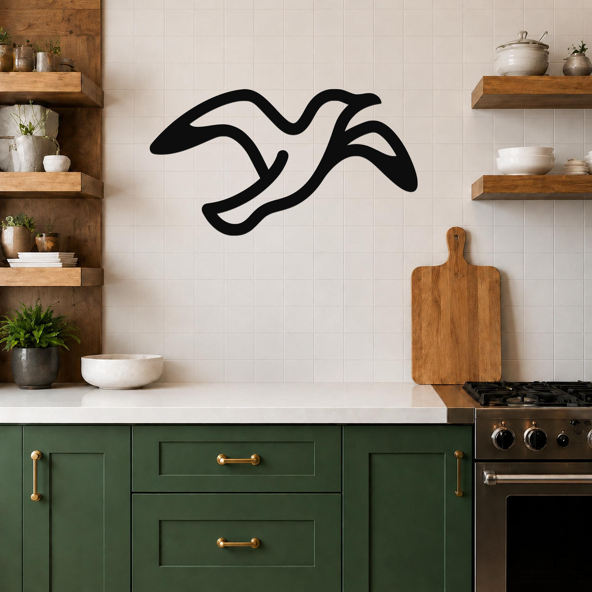 Black metal seagull wall art with flowing motion lines, mounted on a tiled kitchen wall above a counter.