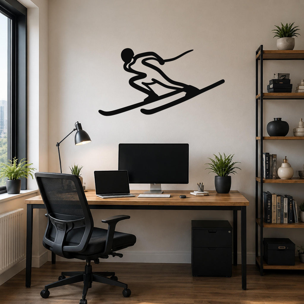 Black metal skier silhouette wall art with motion-line cutouts, mounted above a wooden desk in a modern home office.