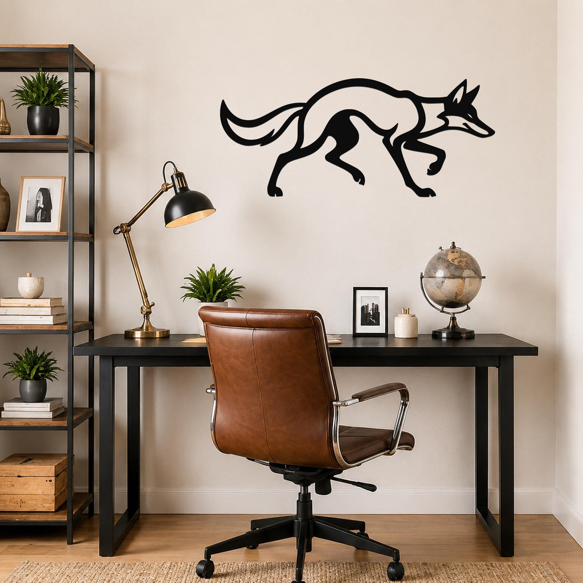 Black metal coyote wall art with a sleek silhouette design, mounted on a light-colored wall above a black desk in a modern home office.
