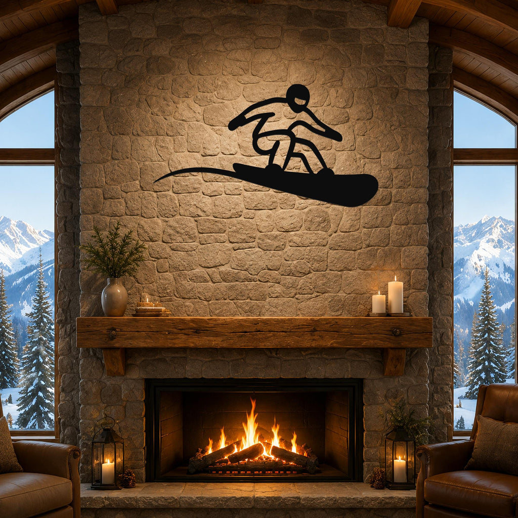 Black metal snowboarder wall art with a dynamic silhouette, mounted above a stone fireplace in a cozy living room with mountain views.