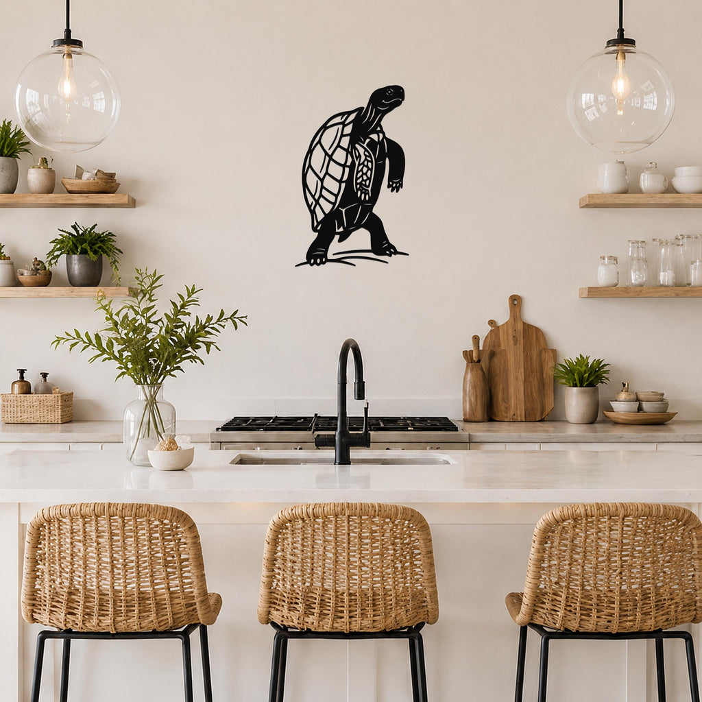 Black metal tortoise wall art with detailed shell cutouts, mounted on a kitchen wall above a counter.
