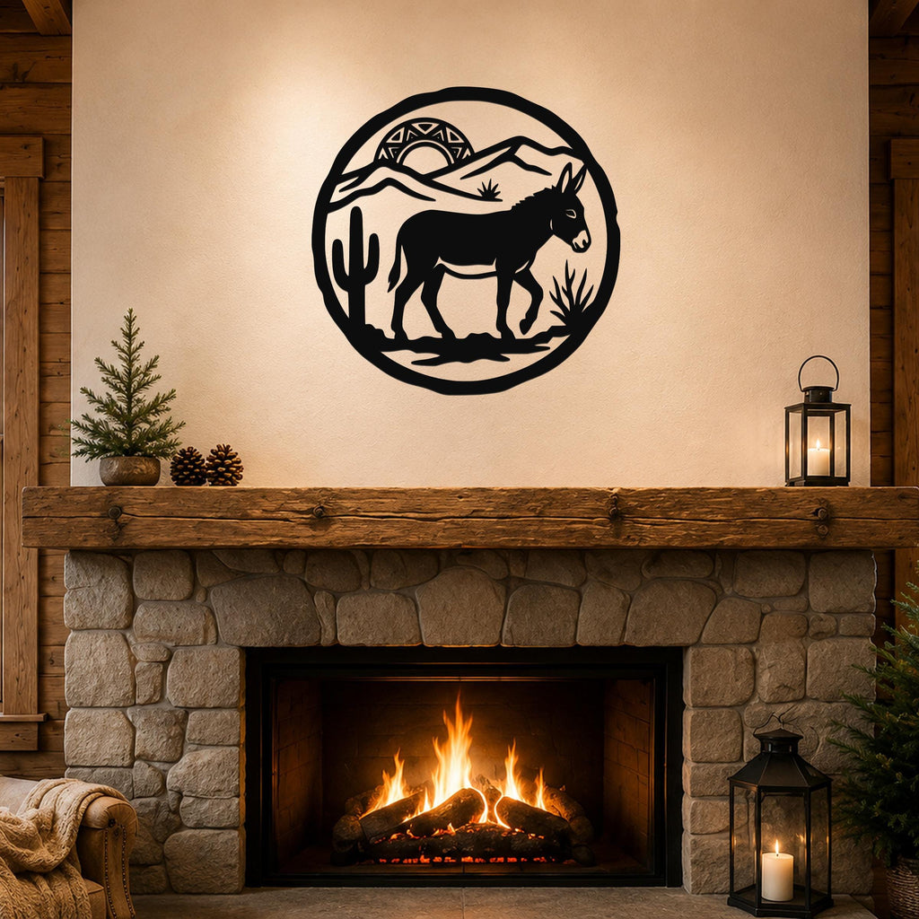 Black metal wall art featuring a burro silhouette in a desert scene with cacti and mountains, mounted above a stone fireplace in a rustic living room.