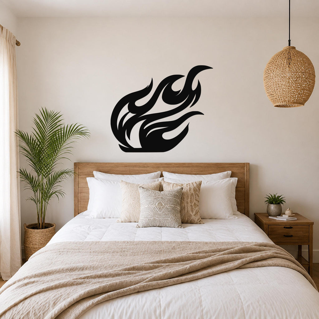 Black metal flame wall art with flowing silhouette cutouts, mounted above a wooden bed in a neutral bedroom.