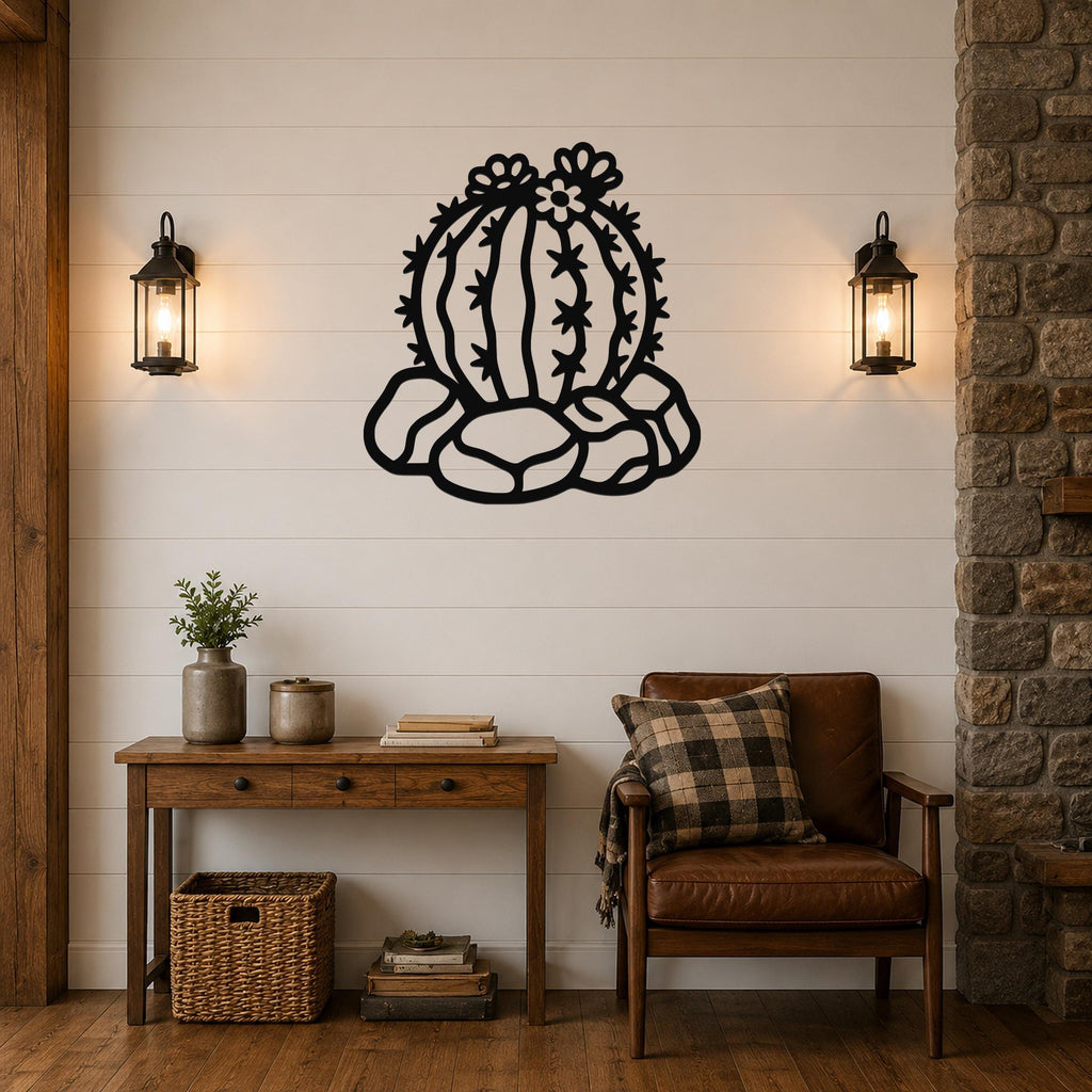 Black metal barrel cactus wall art with flower and spine cutouts, mounted on a white shiplap wall above a wooden console table in a living room.