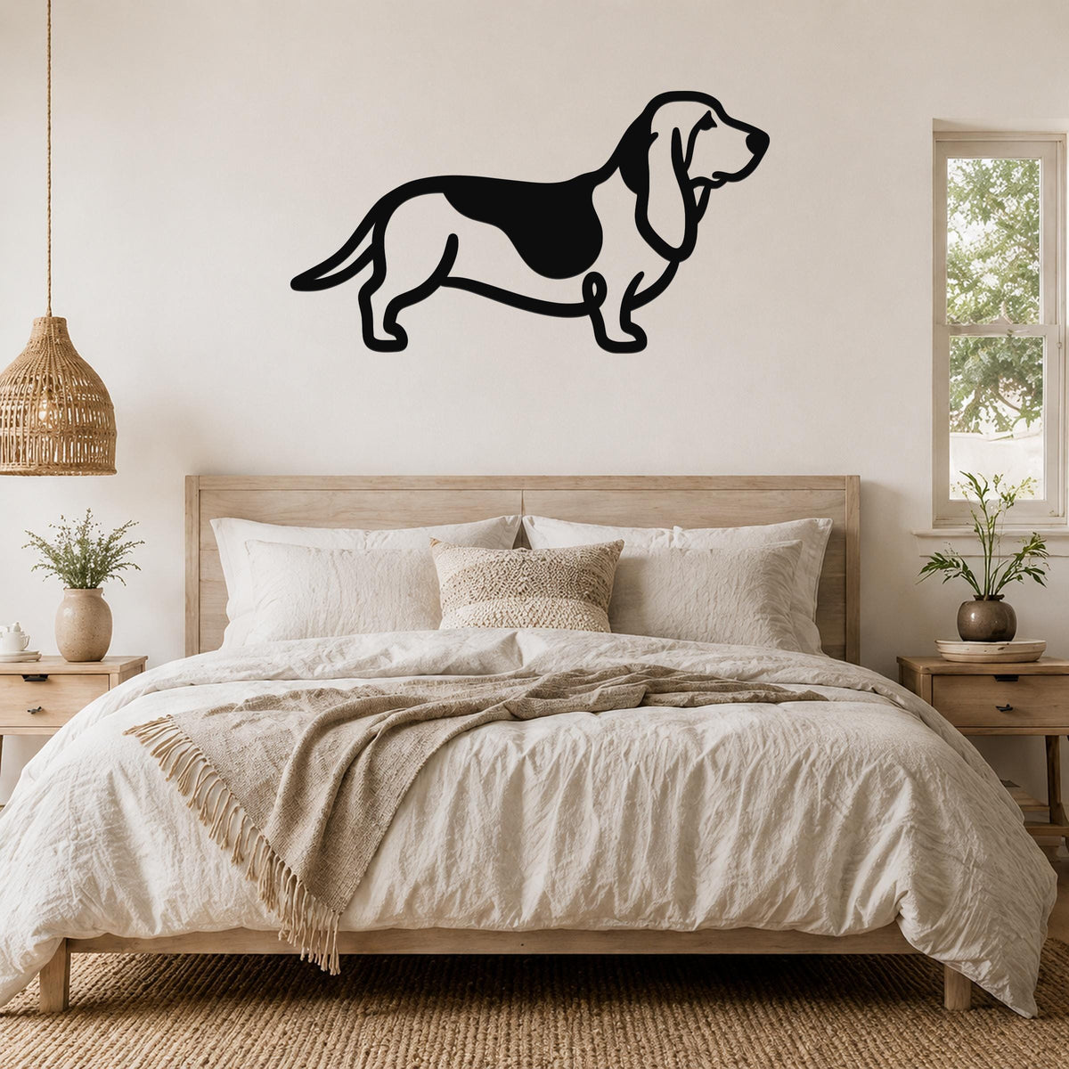 Black metal Basset Hound silhouette wall art mounted above a bed in a neutral bedroom.