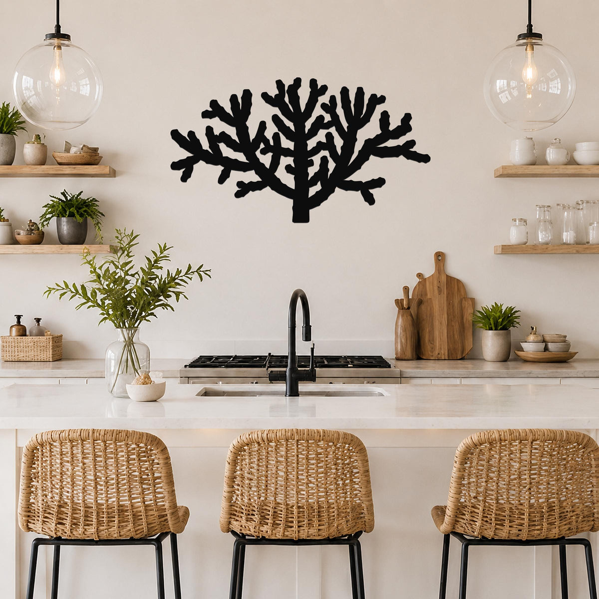 Black metal Cholla cactus wall art silhouette with branching cutouts, mounted on a kitchen wall above a counter.
