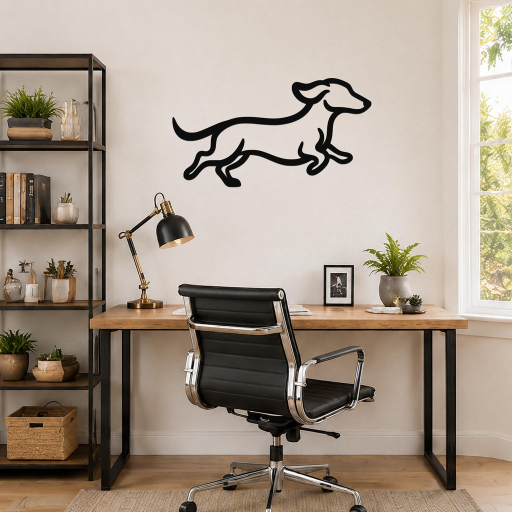 Black metal dachshund wall art with motion-line cutouts, mounted above a wooden desk in a home office.