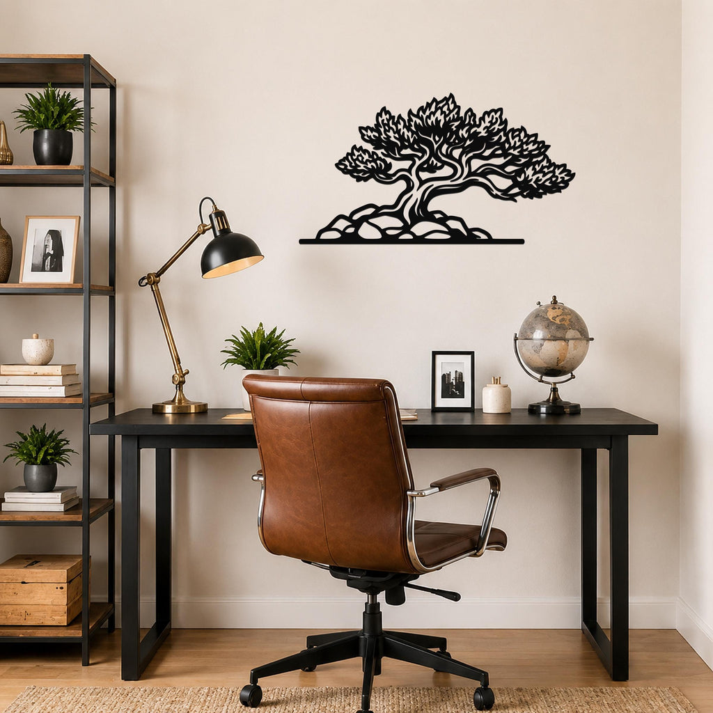 Black metal wall art of a bonsai-style tree with intricate branch cutouts, mounted above a black desk in a home office.