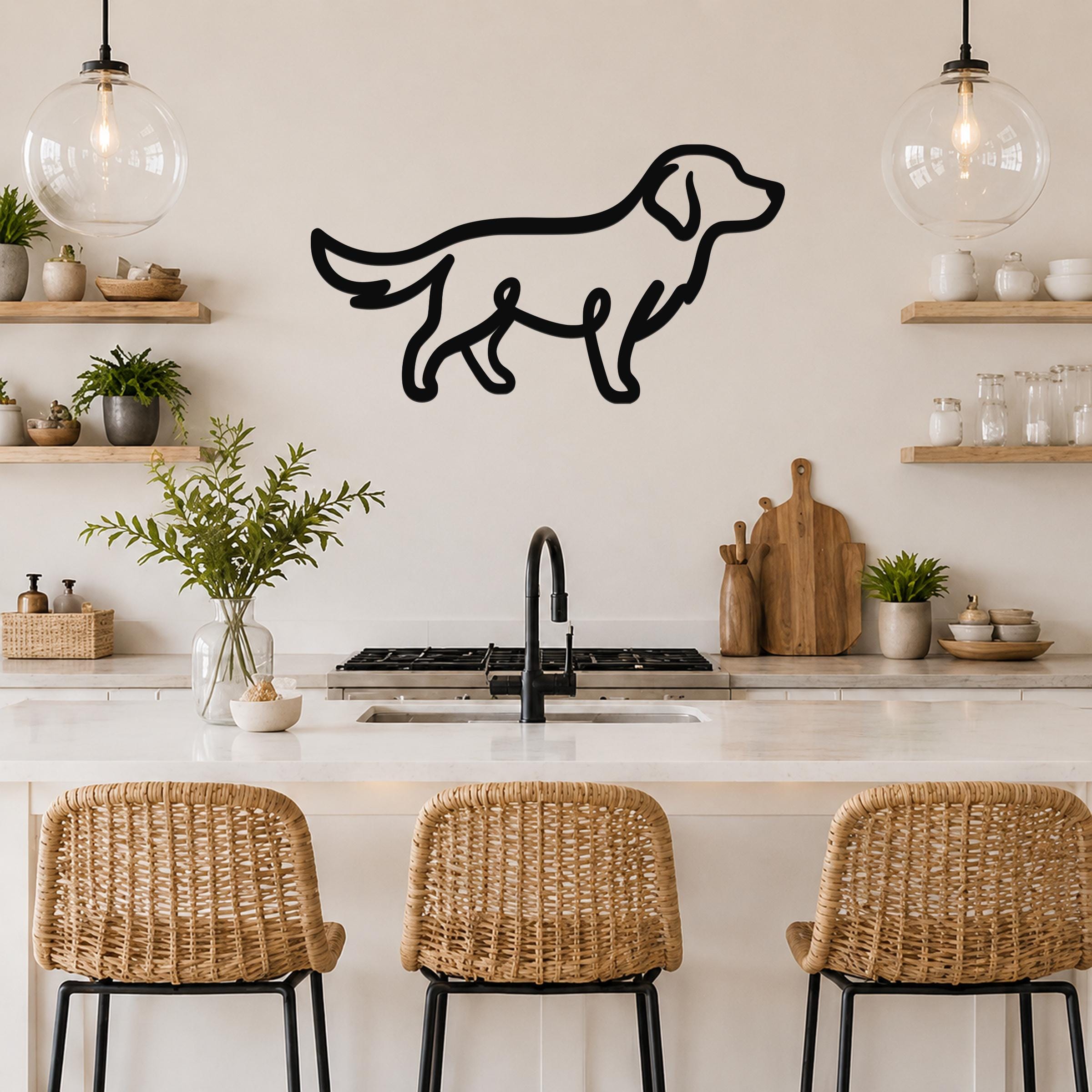 Black metal silhouette wall art of a dog, mounted on a kitchen wall above a counter with wicker bar stools.