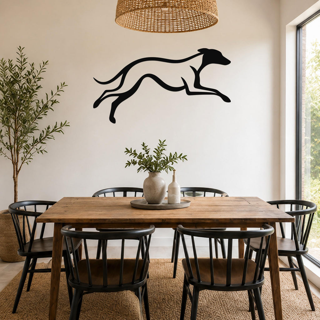 Black metal greyhound wall art with motion-line cutouts, mounted above a wooden dining table in a modern dining room.