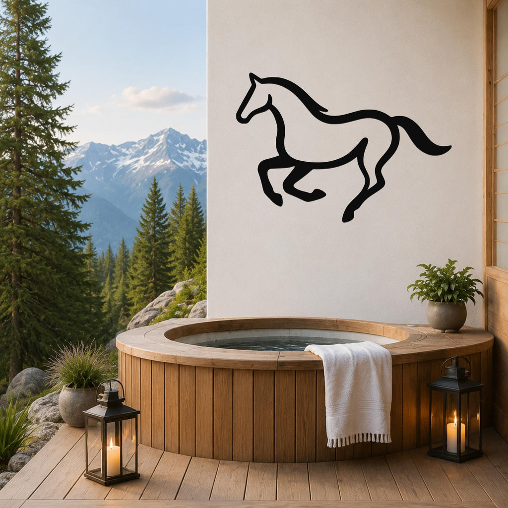 Black metal horse wall art in a running silhouette, mounted on a white wall above a wooden hot tub on a mountain-view patio.