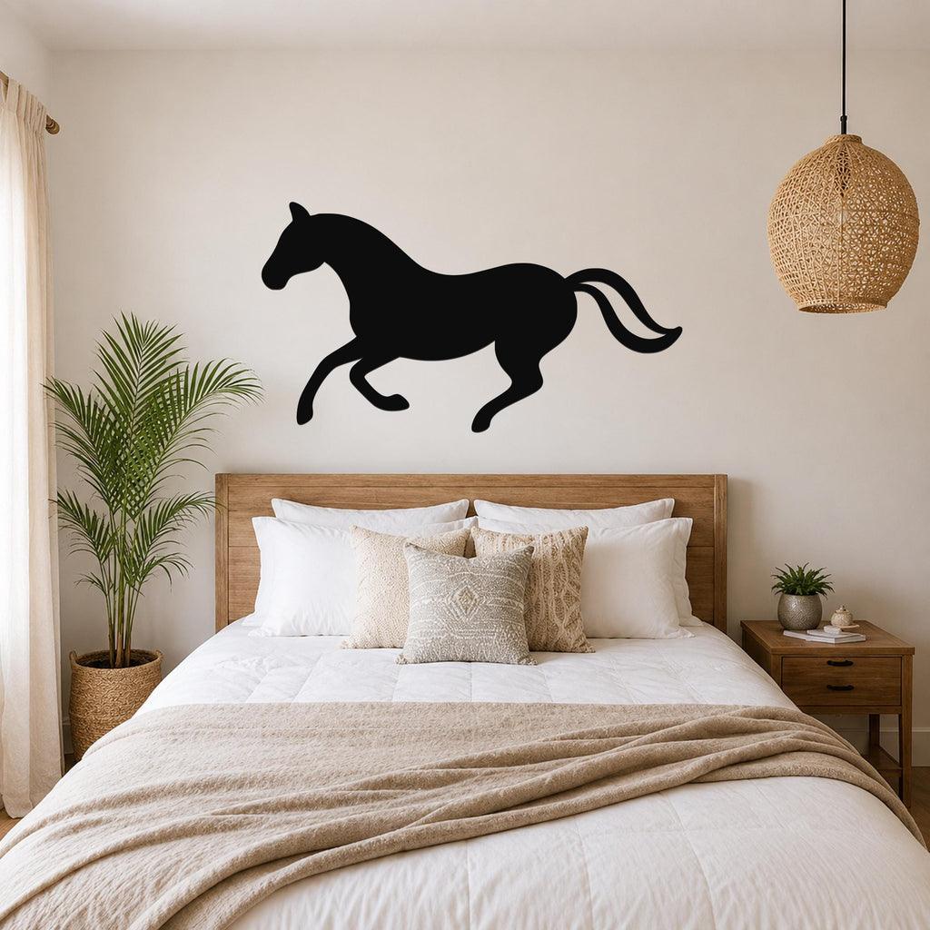 Black metal horse wall art silhouette mounted above a wooden bed in a neutral bedroom.