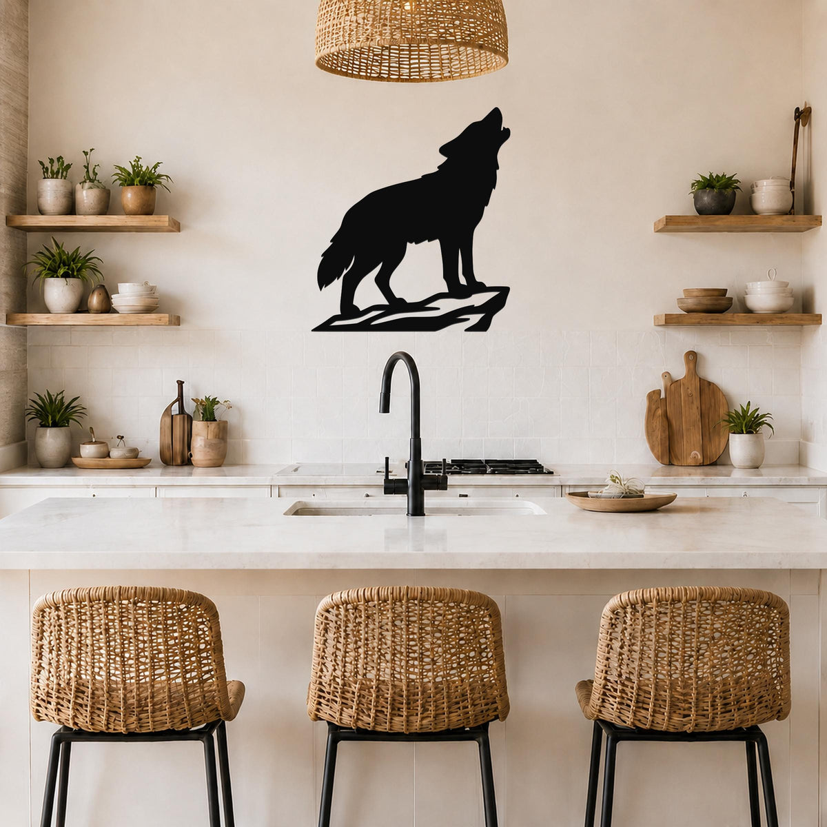 Black metal coyote wall art silhouette howling on a rock, mounted above a kitchen counter with wicker bar stools and open shelves.