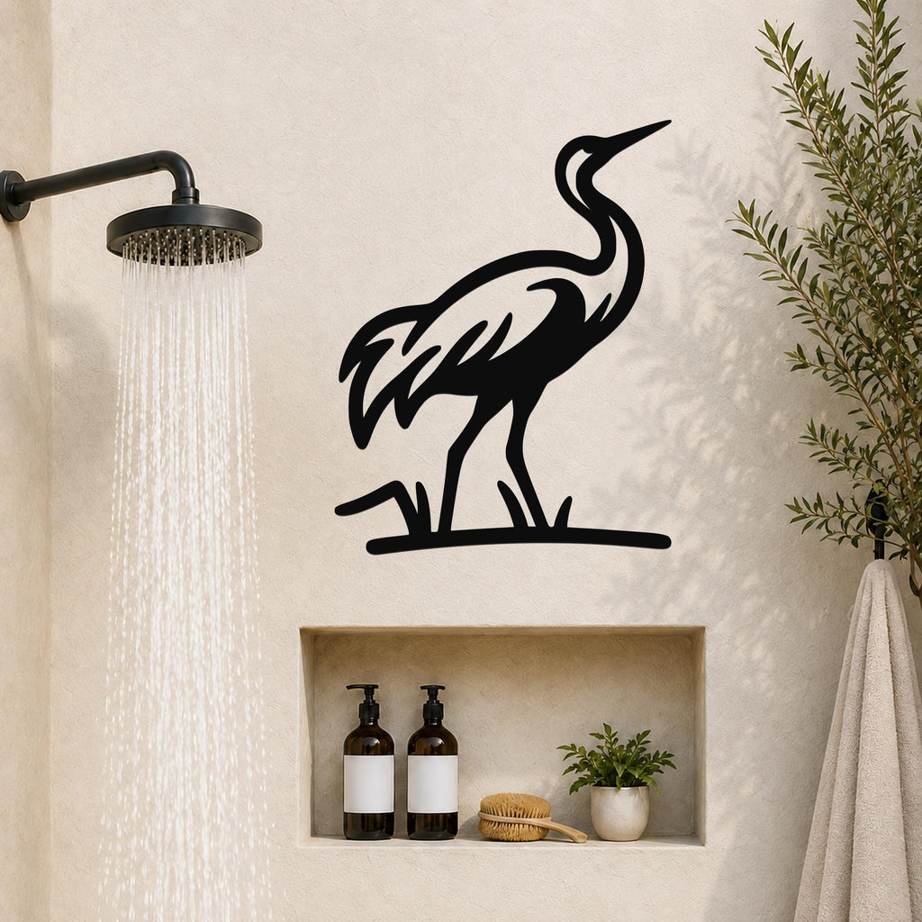 Black metal crane wall art with a silhouette design, mounted on a bathroom wall above a built-in shelf.