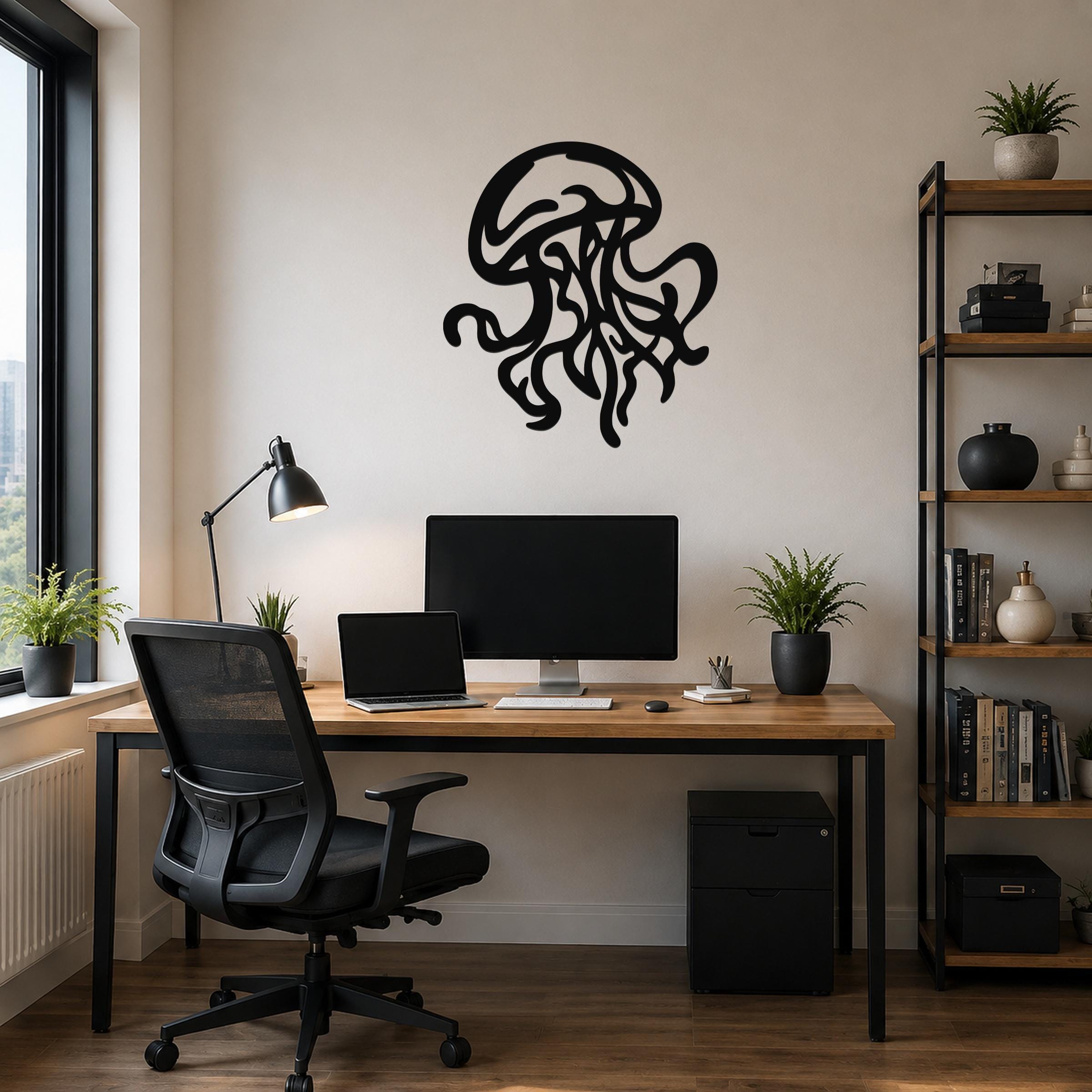 Black metal jellyfish wall art with tentacle cutouts, mounted on a beige wall above a wooden desk in a home office.
