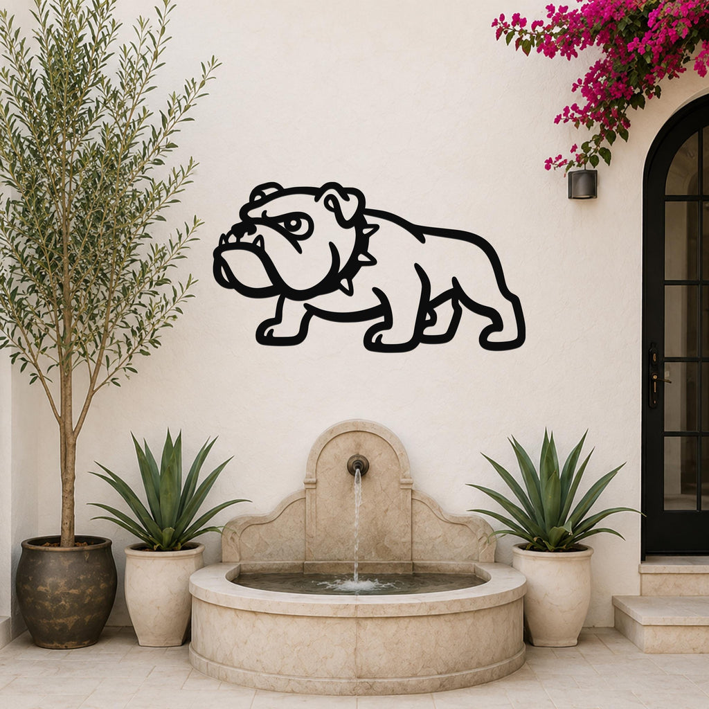 Black metal bulldog wall sculpture with bold silhouette, mounted on a light-colored outdoor wall above a stone fountain.