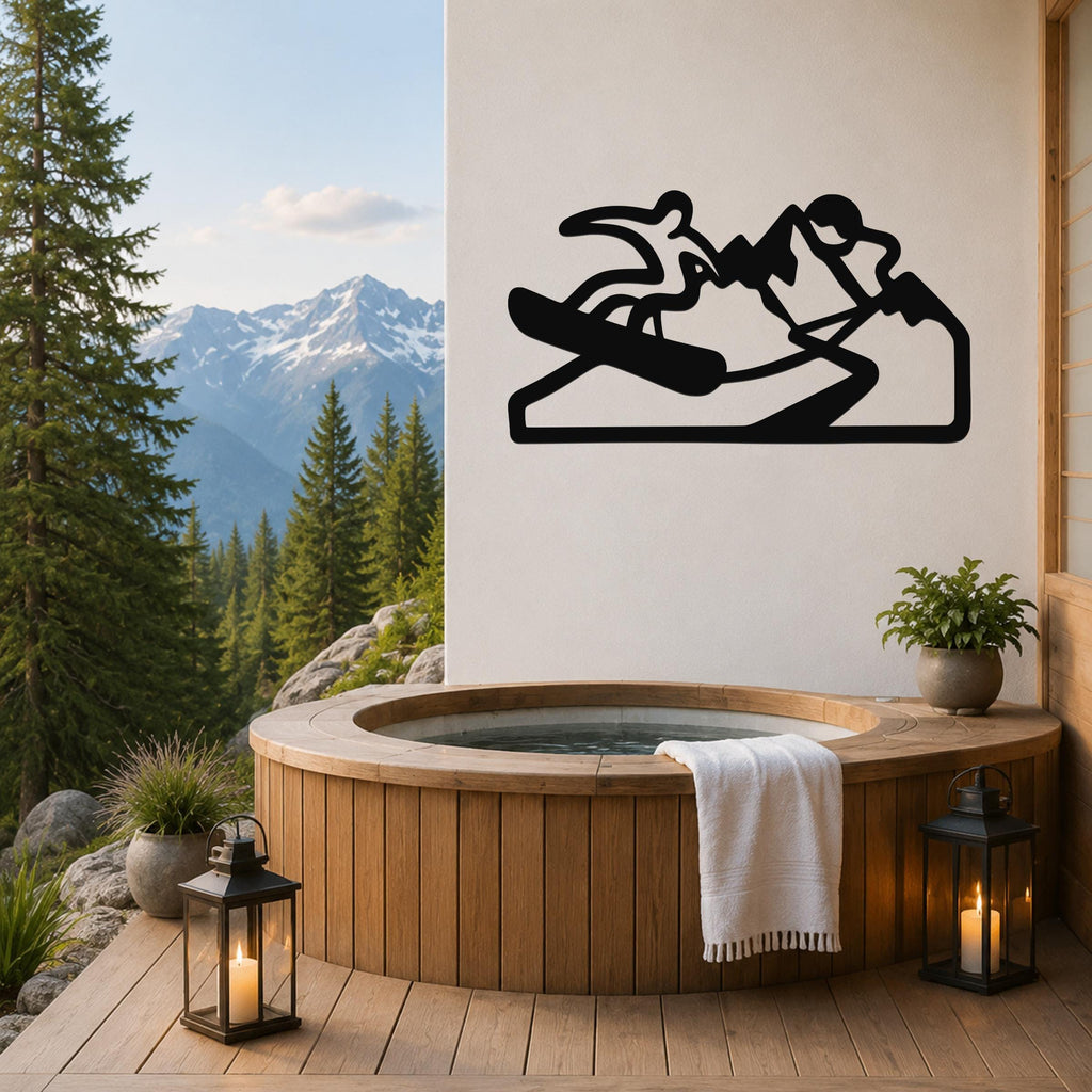Black metal wall art silhouette of a snowboarder on a mountain, mounted on a white wall above a wooden hot tub on a deck with a mountain view.