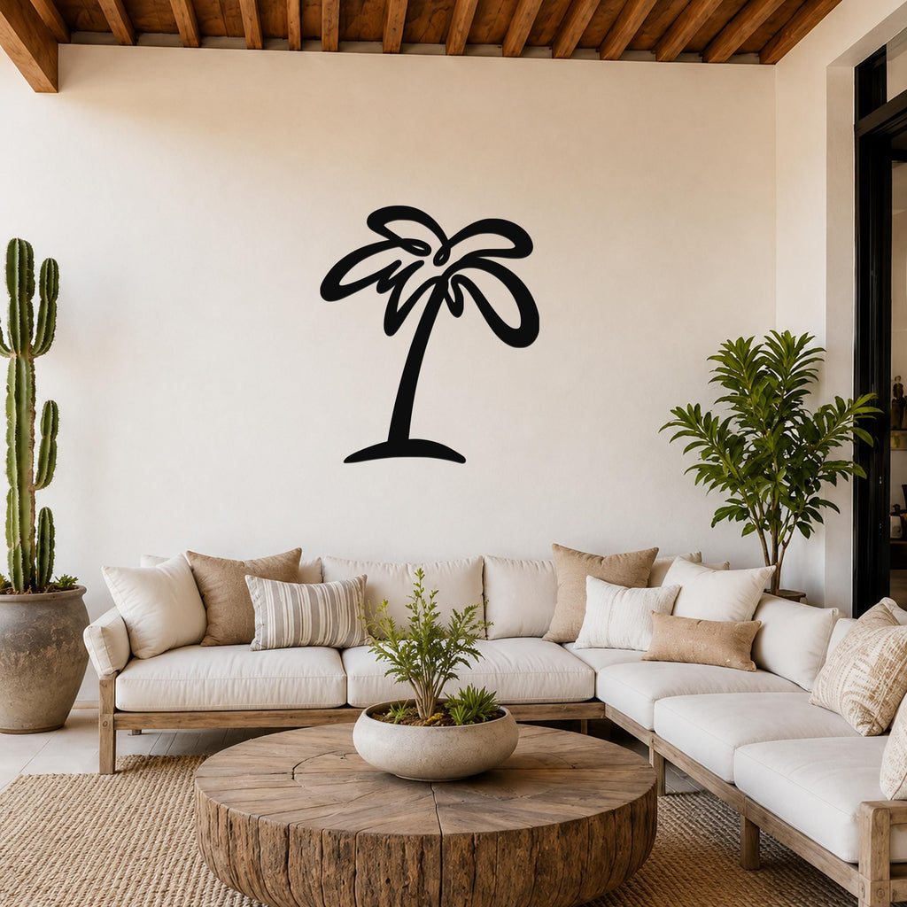 Black metal palm tree wall art with flowing frond cutouts, mounted on a living room wall above a white sofa.
