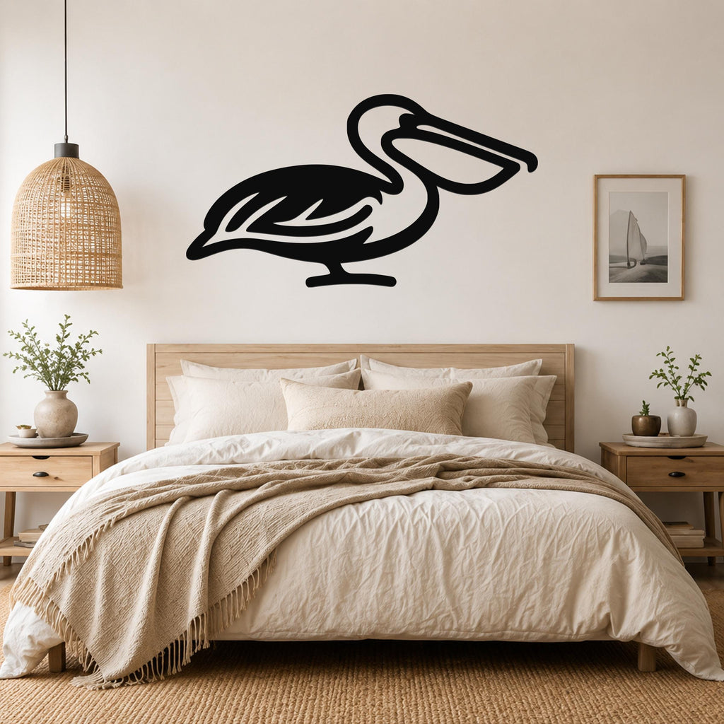 Black metal pelican wall art silhouette mounted above a bed in a neutral bedroom.