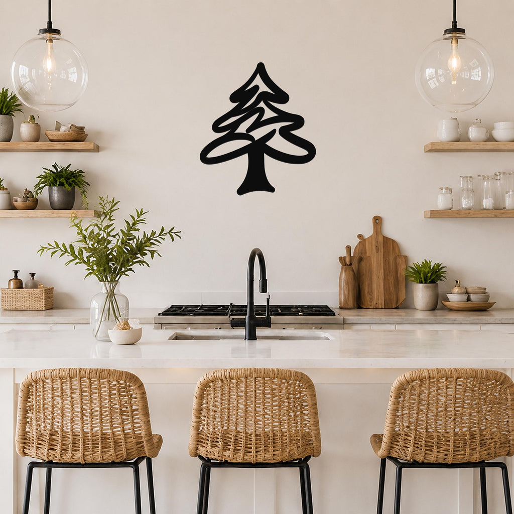 Black metal pine tree wall art with layered branch cutouts, mounted on a kitchen wall above a counter.