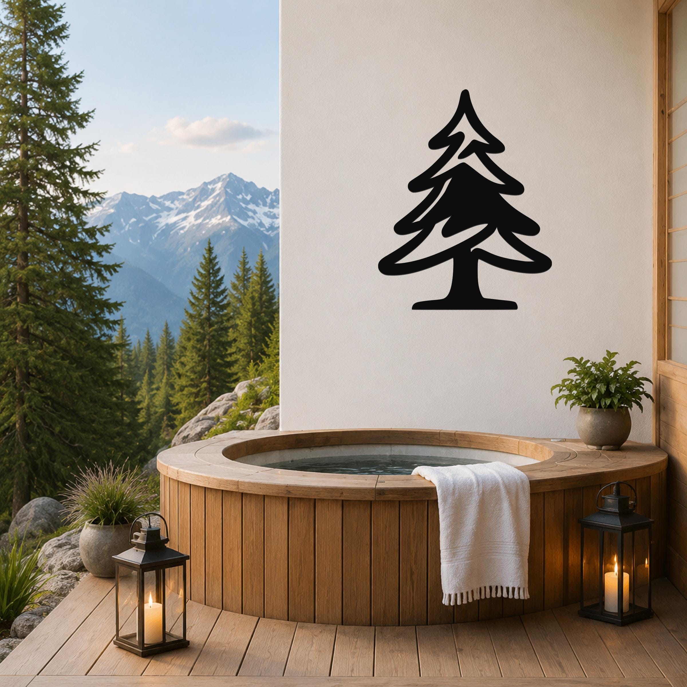 Black metal pine tree wall art silhouette mounted on a white wall above a wooden hot tub on a mountain-view deck.