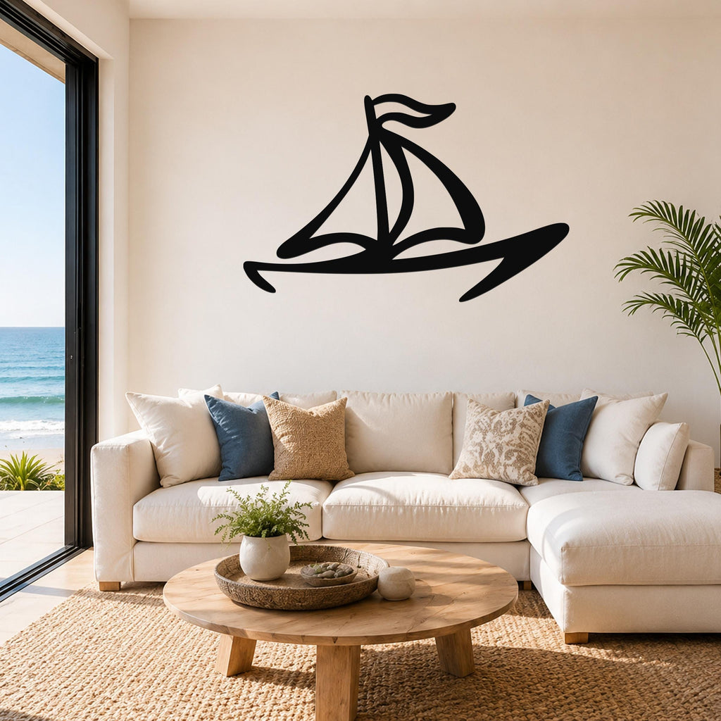 Black metal sailboat wall art with bold silhouette lines, mounted above a white sofa in a coastal living room.